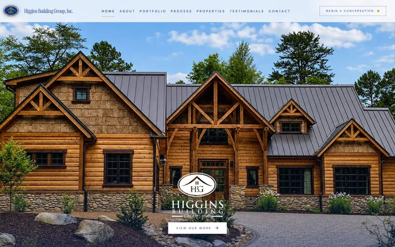 Higgins Building Group homepage with a full-width photo of a timber-frame home.